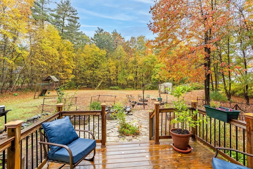 93 Turner Road Townsend, MA 01469 - Photo 31 of 32 a view of a balcony with chairs and wooden fence