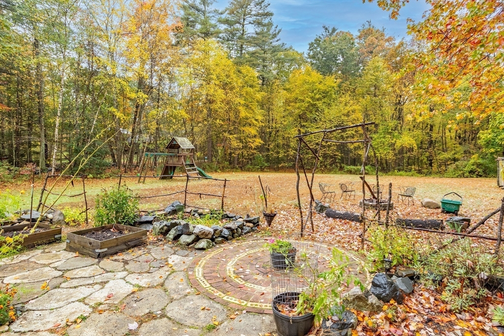 93 Turner Road Townsend, MA 01469 - Photo 32 of 32 a view of a swimming pool with a patio