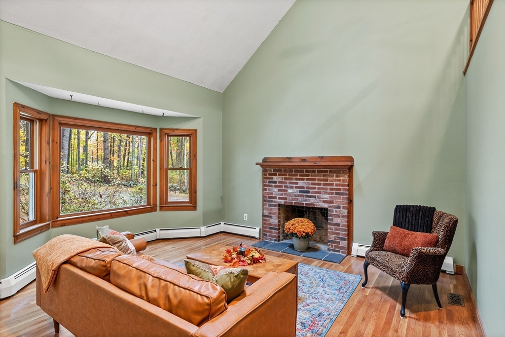 93 Turner Road Townsend, MA 01469 - Photo 5 of 32 a living room with furniture and a fireplace