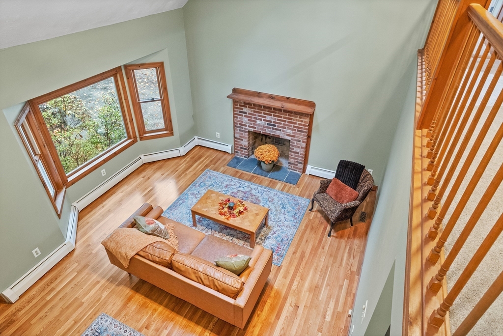 93 Turner Road Townsend, MA 01469 - Photo 6 of 32 a living room with furniture and a fireplace