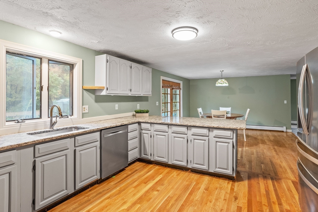 93 Turner Road Townsend, MA 01469 - Photo 10 of 32 a large kitchen with a sink and cabinets