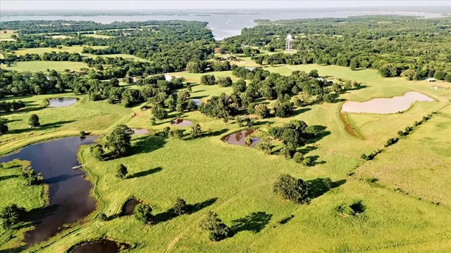 a front view of a house with a yard and porch