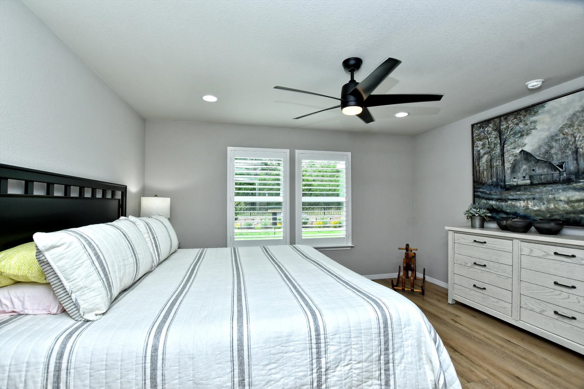 231 Hobby Street Georgetown, TX 78633 - Photo 16 of 29 Well-lit sleeping quarters featuring elegant hardwood-style flooring.