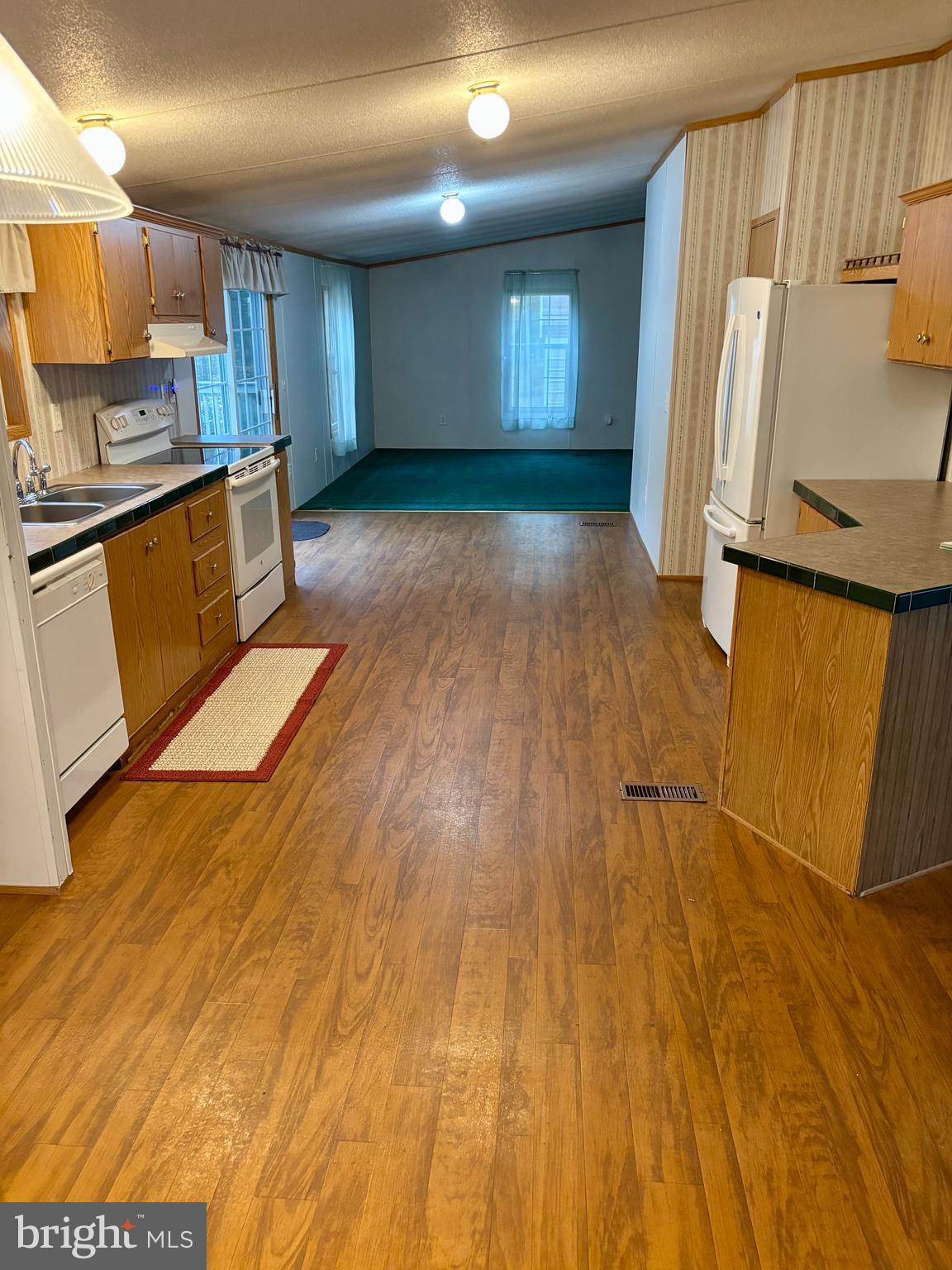 8568 Deer Road Slatington, PA 18080 - Photo 18 of 37 a view of a kitchen with wooden floor and electronic appliances