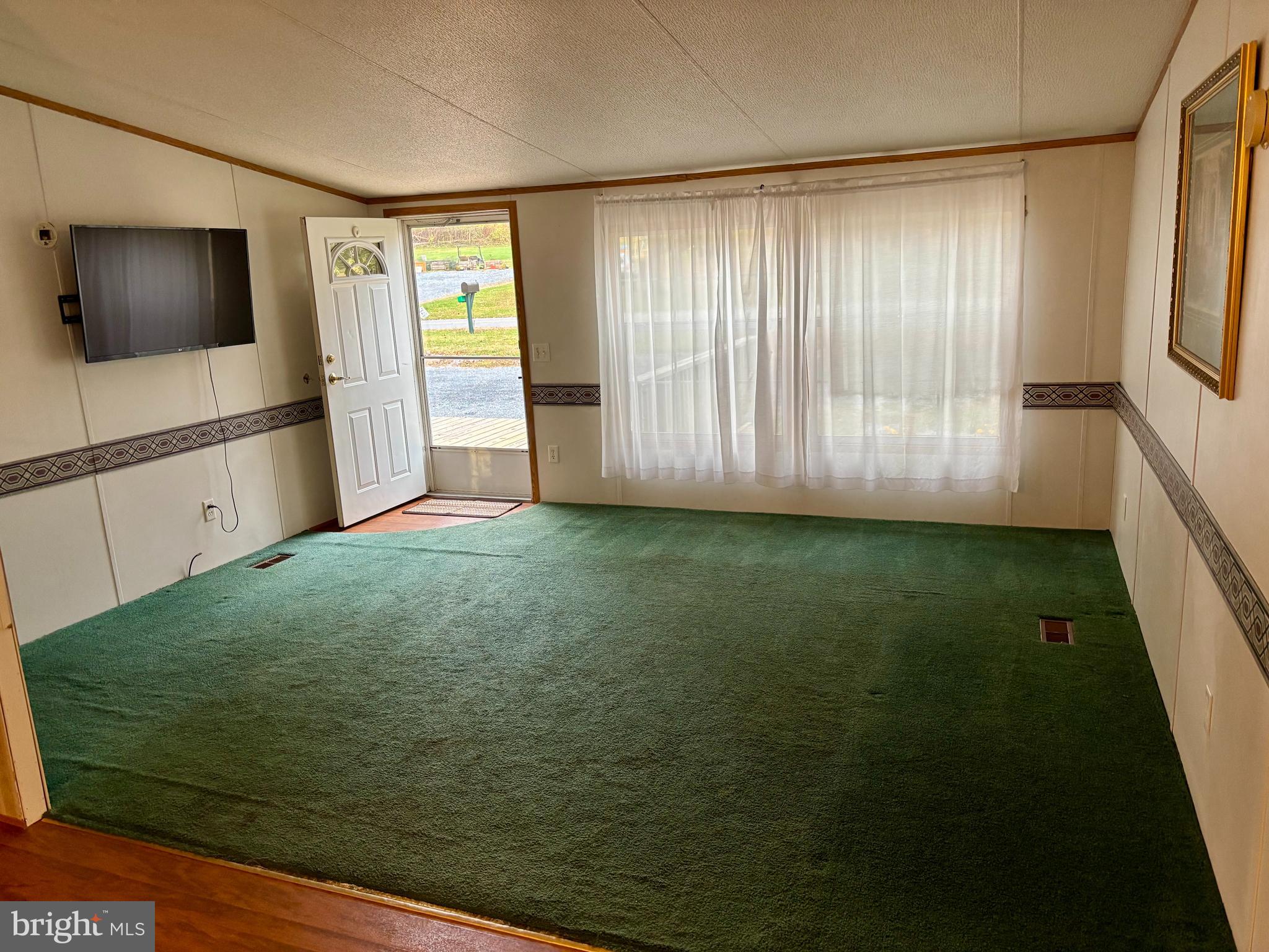 8568 Deer Road Slatington, PA 18080 - Photo 2 of 37 a view of an empty room with a window
