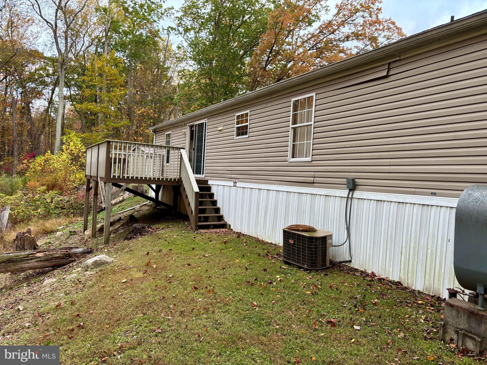 8568 Deer Road Slatington, PA 18080 - Photo 25 of 37 a backyard of a house with a bench and trees