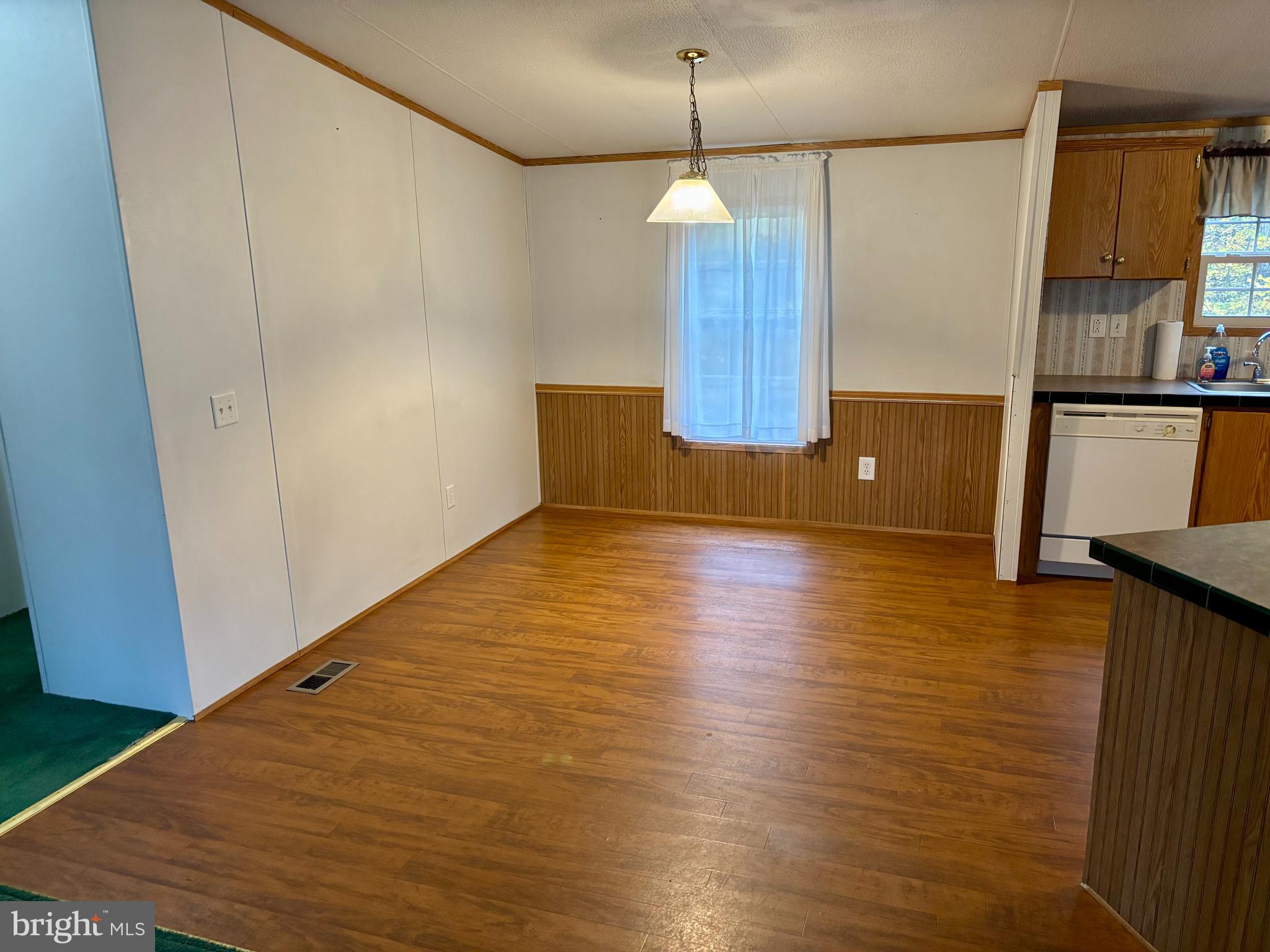 8568 Deer Road Slatington, PA 18080 - Photo 3 of 37 a view of a kitchen with a sink and dishwasher wooden floor