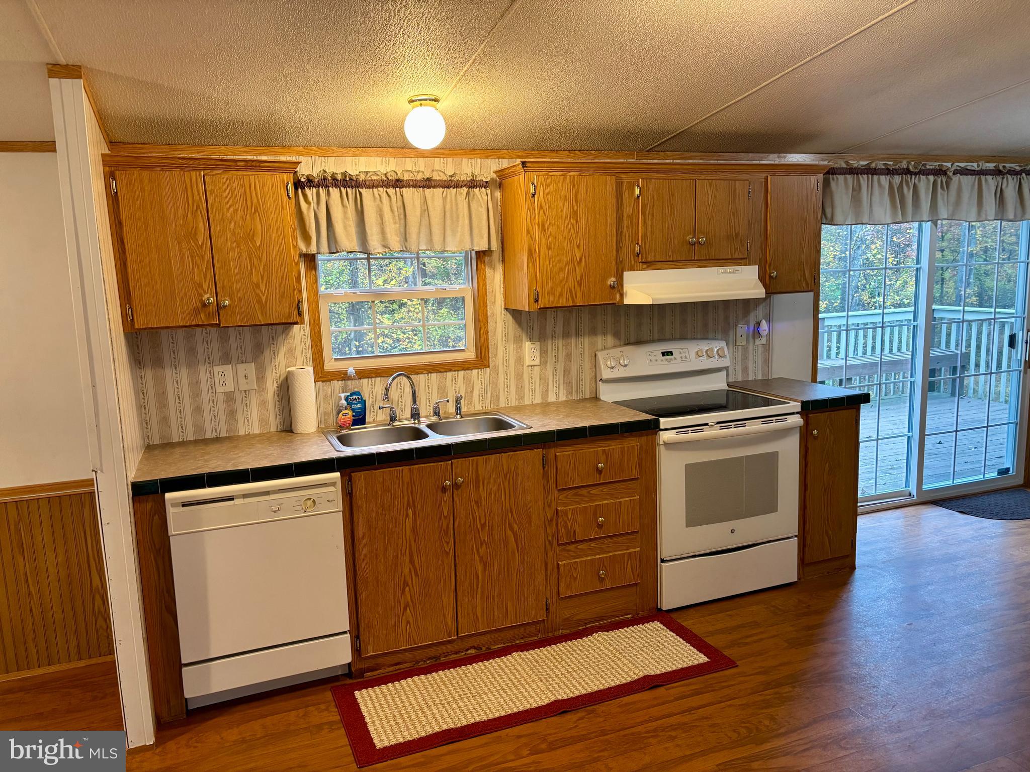 8568 Deer Road Slatington, PA 18080 - Photo 4 of 37 a kitchen with a sink window and cabinets