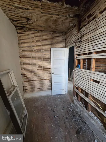 a view of a room with wooden walls