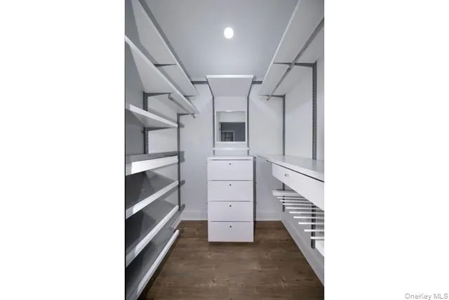 a view of a hallway with closet