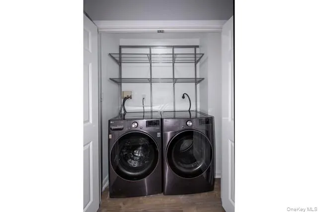 a view of livingroom with washer and dryer