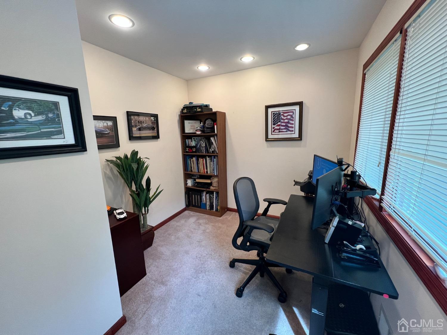 55 Winton Road East Brunswick, NJ 08816 - Photo 12 of 39 a view of a workspace with furniture and a potted plant
