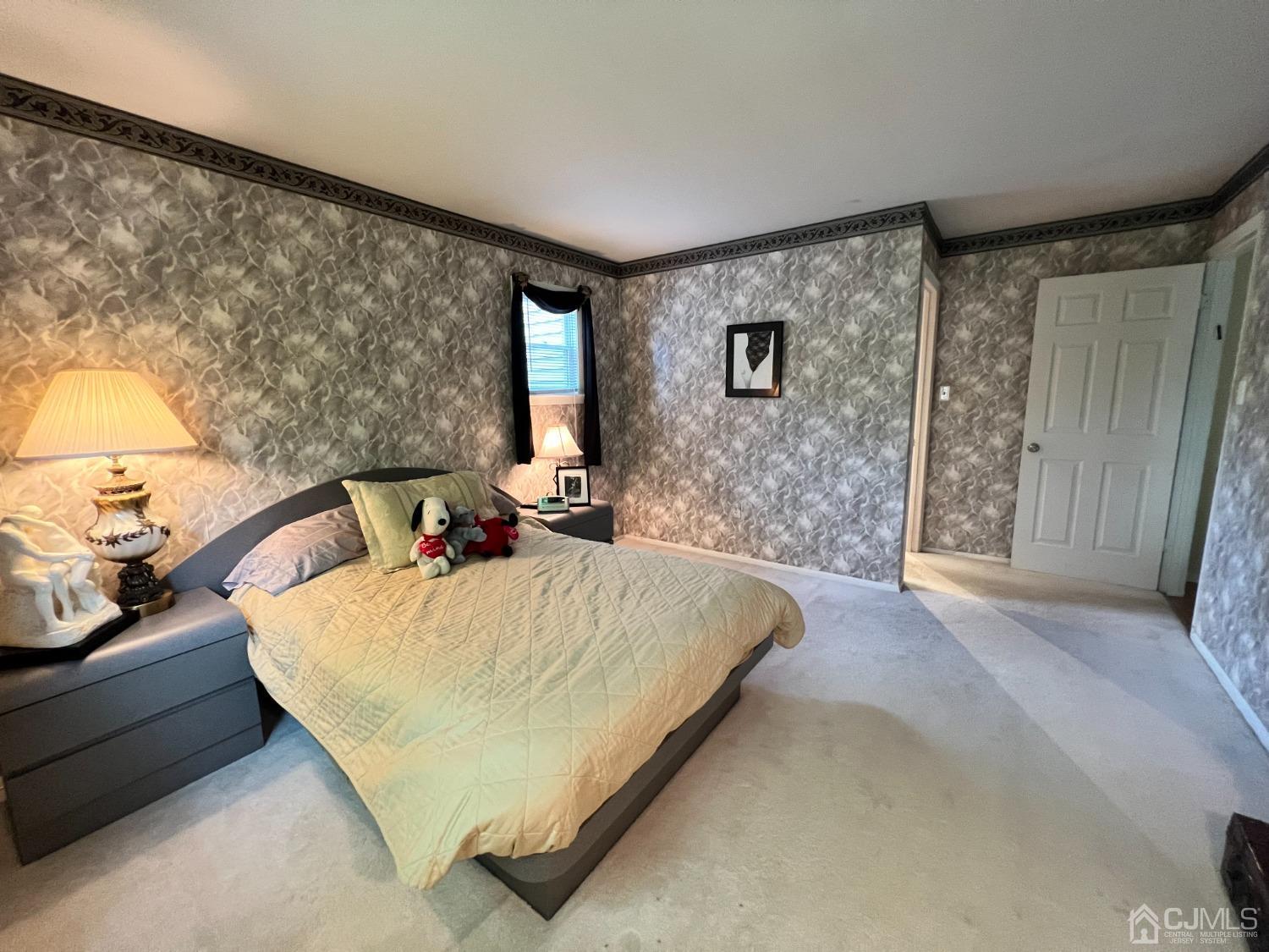 55 Winton Road East Brunswick, NJ 08816 - Photo 15 of 39 a bed sitting in a spacious bedroom next to a window