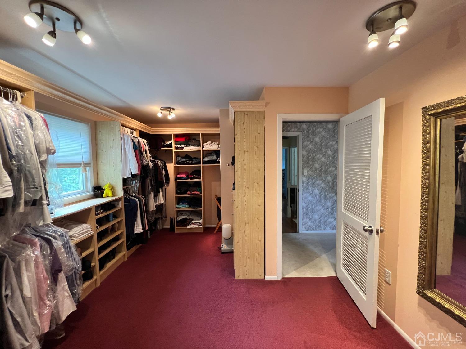 55 Winton Road East Brunswick, NJ 08816 - Photo 19 of 39 a view of walk in closet with clothes and shoes