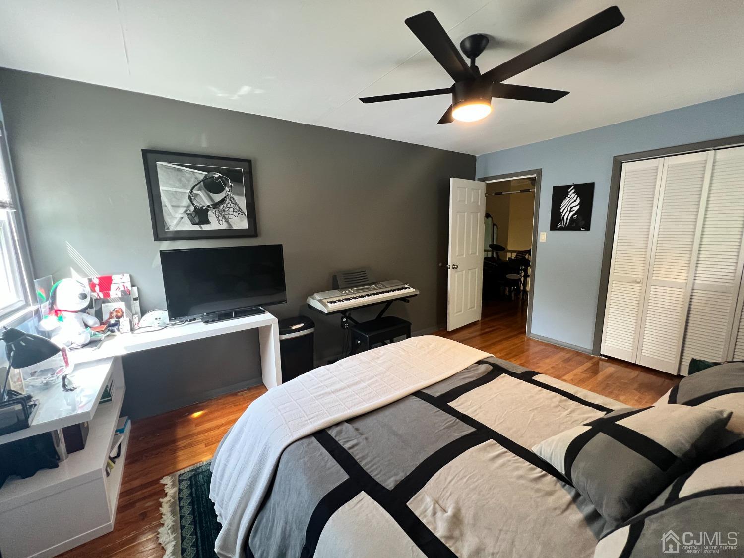 55 Winton Road East Brunswick, NJ 08816 - Photo 21 of 39 a bedroom with a bed and a flat screen tv