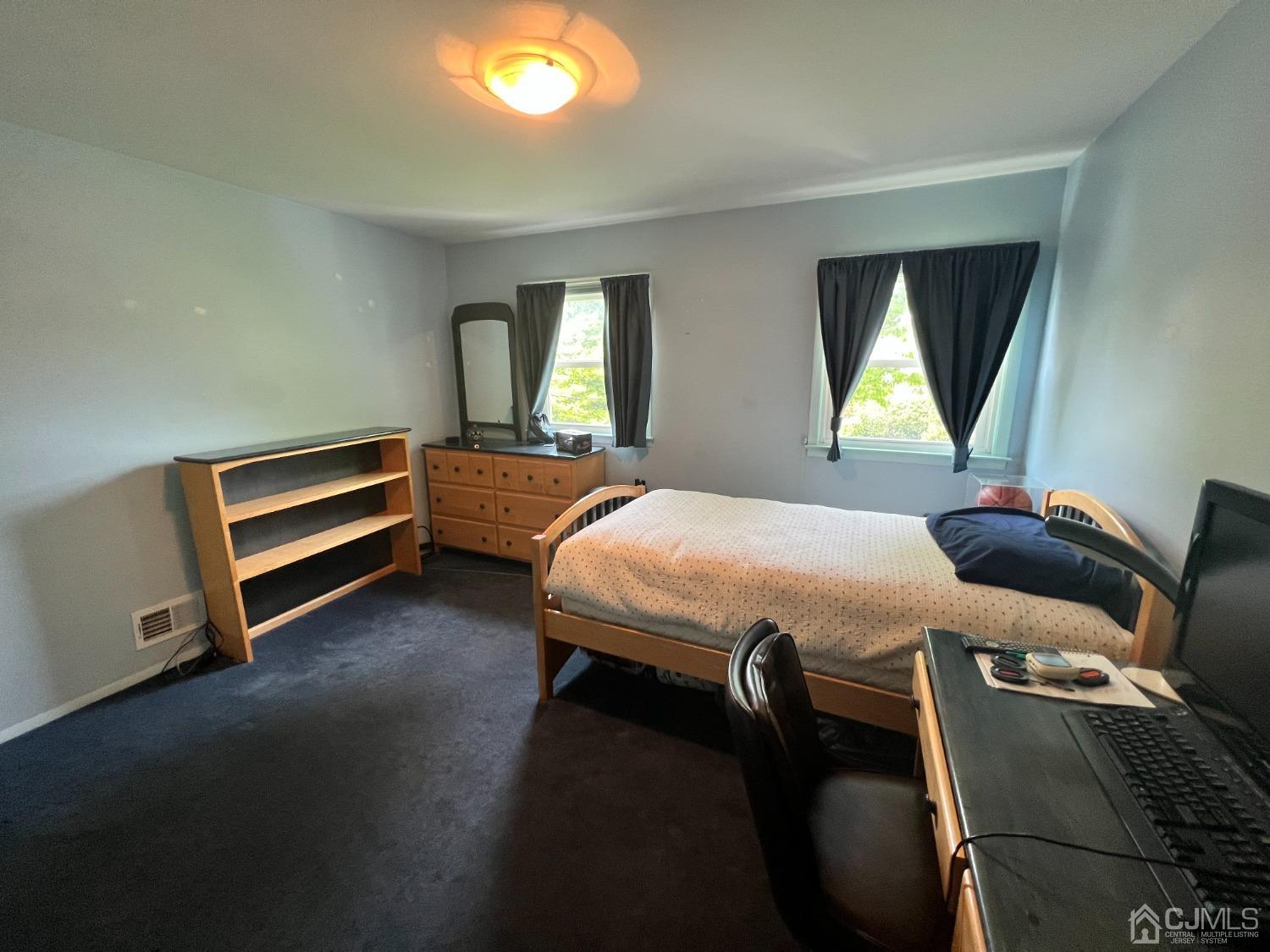 55 Winton Road East Brunswick, NJ 08816 - Photo 24 of 39 a bed room with a bed and a window