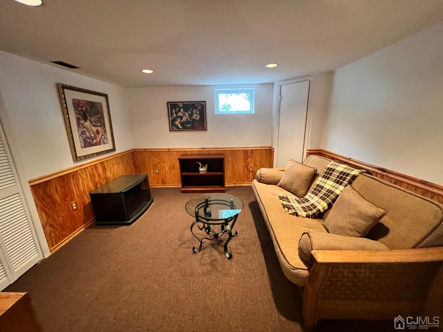 55 Winton Road East Brunswick, NJ 08816 - Photo 27 of 39 a living room with furniture and a fireplace