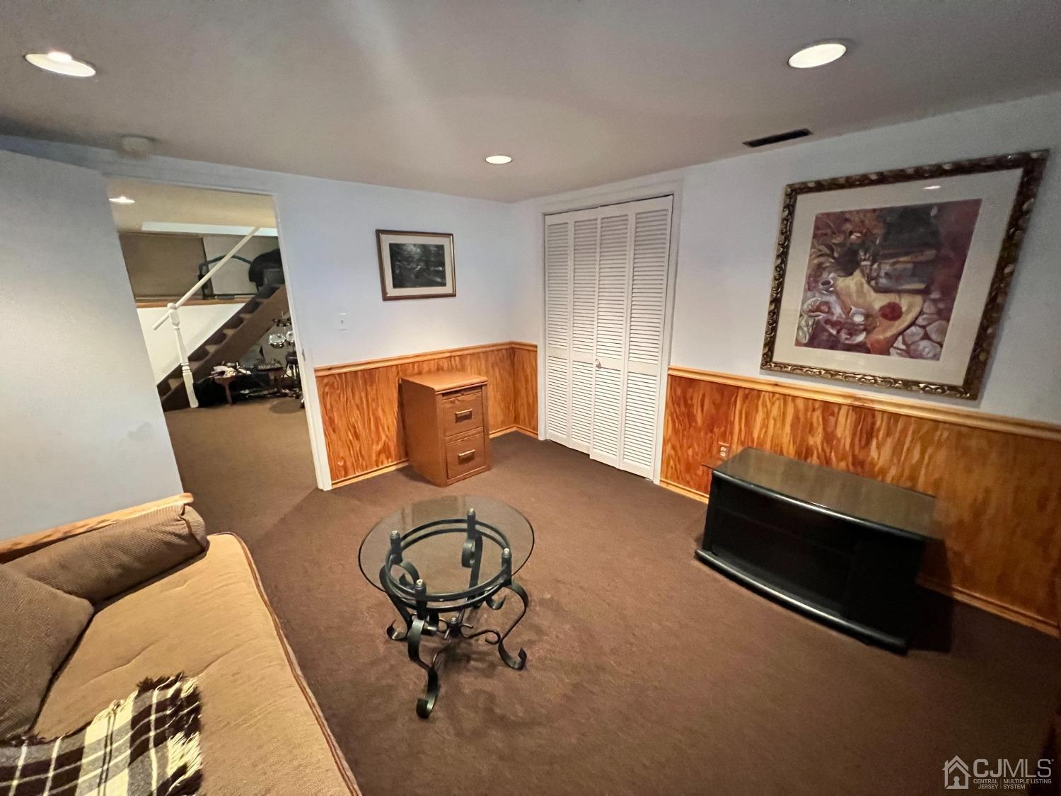 55 Winton Road East Brunswick, NJ 08816 - Photo 28 of 39 a living room with furniture and a flat screen tv