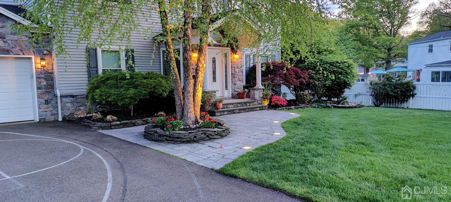 55 Winton Road East Brunswick, NJ 08816 - Photo 34 of 39 a front view of a house with a yard and tree s