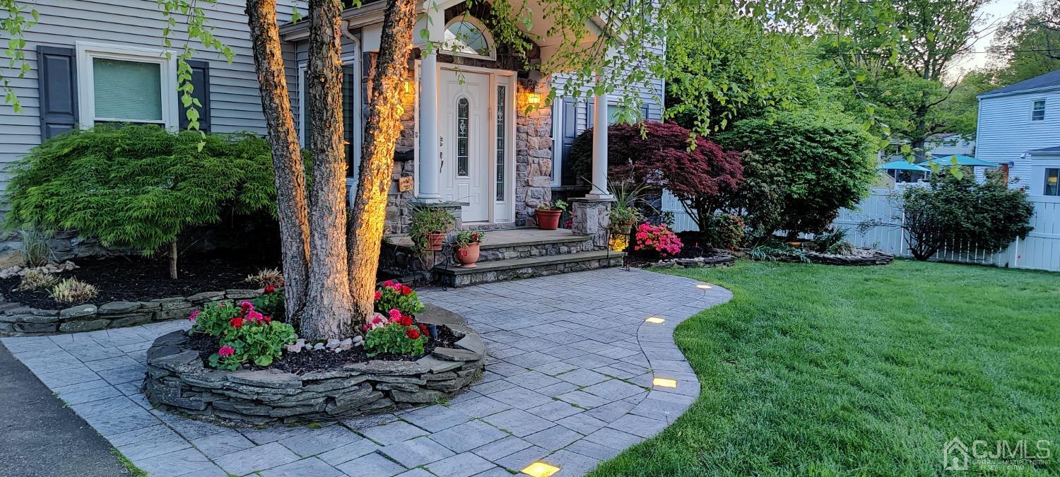 55 Winton Road East Brunswick, NJ 08816 - Photo 35 of 39 a front view of a house with a yard and potted plants