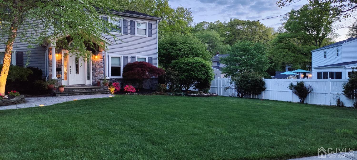 55 Winton Road East Brunswick, NJ 08816 - Photo 36 of 39 a front view of a house with a garden and trees