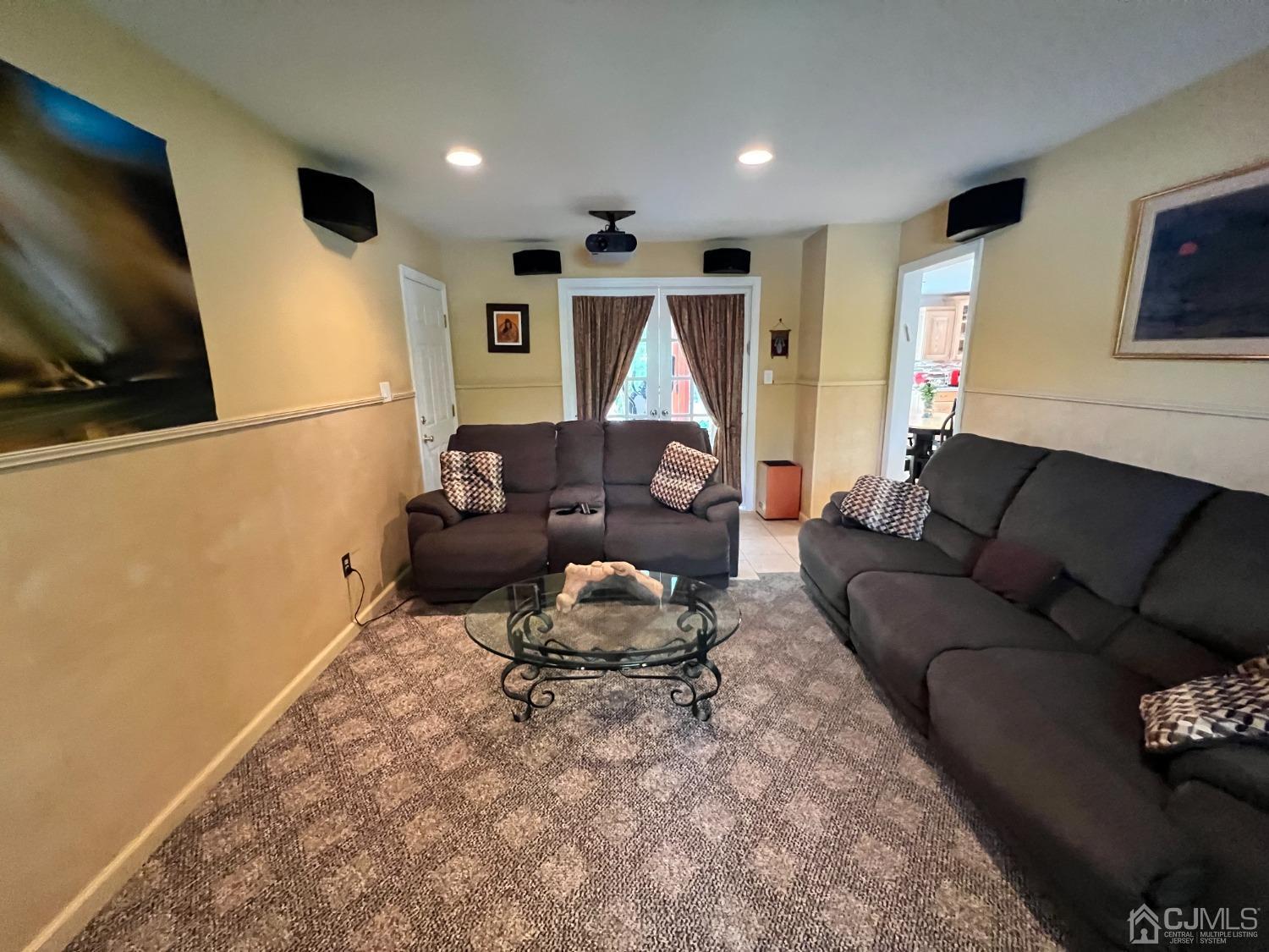 55 Winton Road East Brunswick, NJ 08816 - Photo 8 of 39 a living room with furniture and a flat screen tv