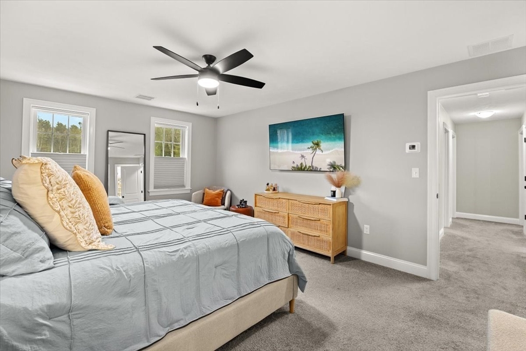 70 Sandy Hill Road Raynham, MA 02767 - Photo 20 of 42 a bedroom with a bed and a dresser