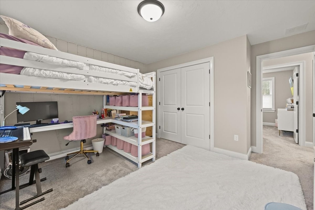 70 Sandy Hill Road Raynham, MA 02767 - Photo 27 of 42 a bedroom with a bed and a desk