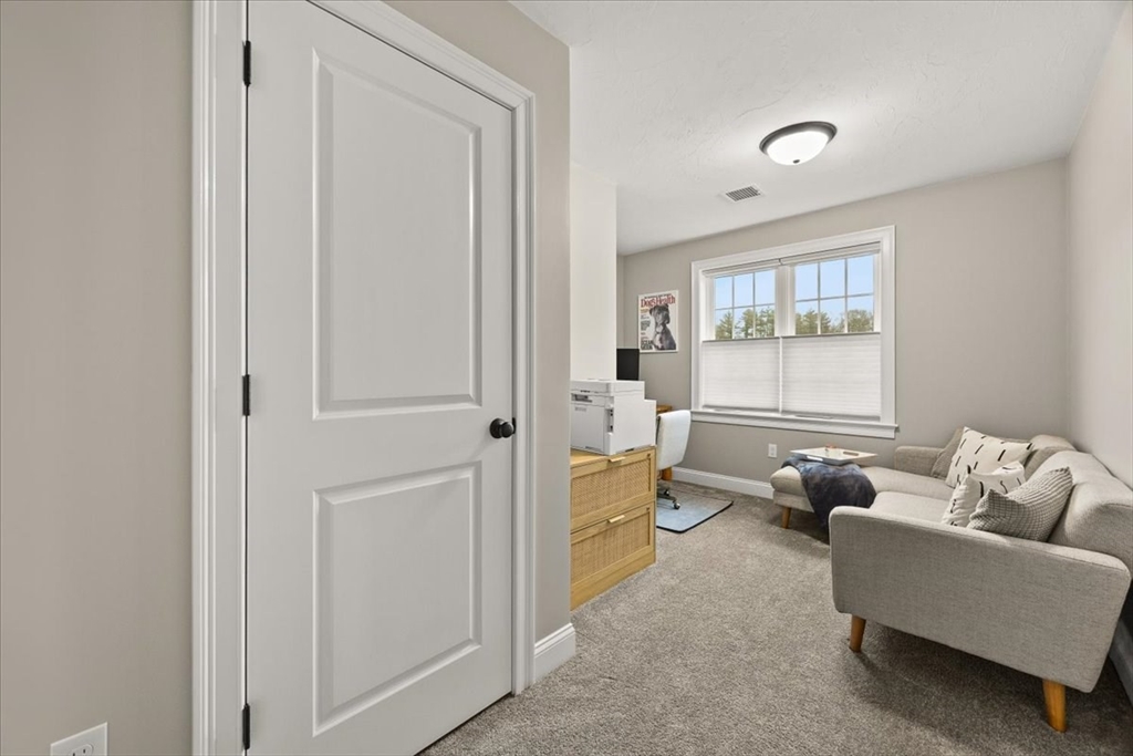 70 Sandy Hill Road Raynham, MA 02767 - Photo 28 of 42 a living room with furniture and a window