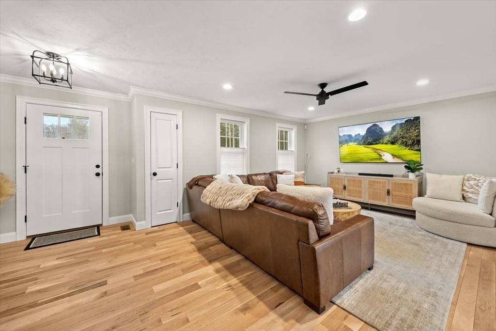 70 Sandy Hill Road Raynham, MA 02767 - Photo 4 of 42 a living room with furniture and a flat screen tv