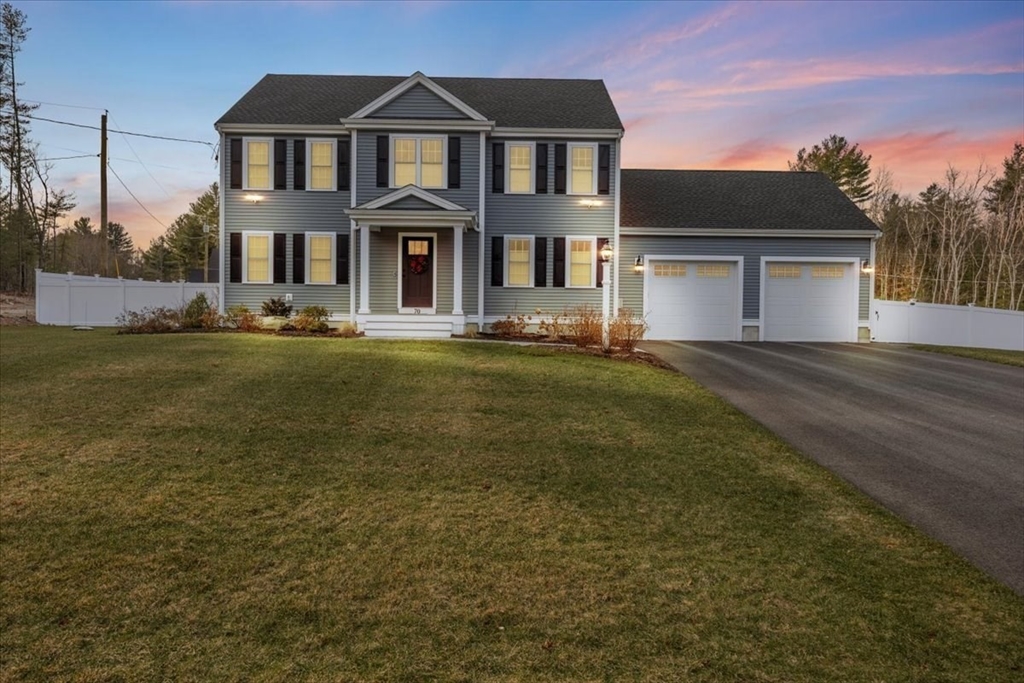 70 Sandy Hill Road Raynham, MA 02767 - Photo 42 of 42 a front view of a house with a yard