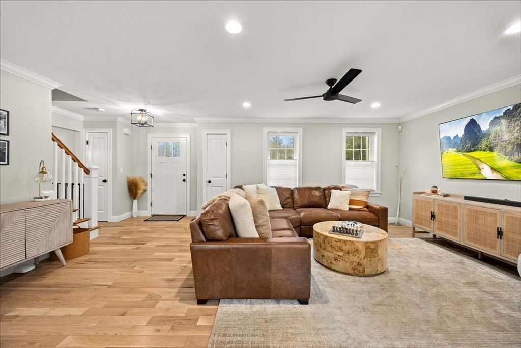70 Sandy Hill Road Raynham, MA 02767 - Photo 5 of 42 a living room with furniture and a flat screen tv