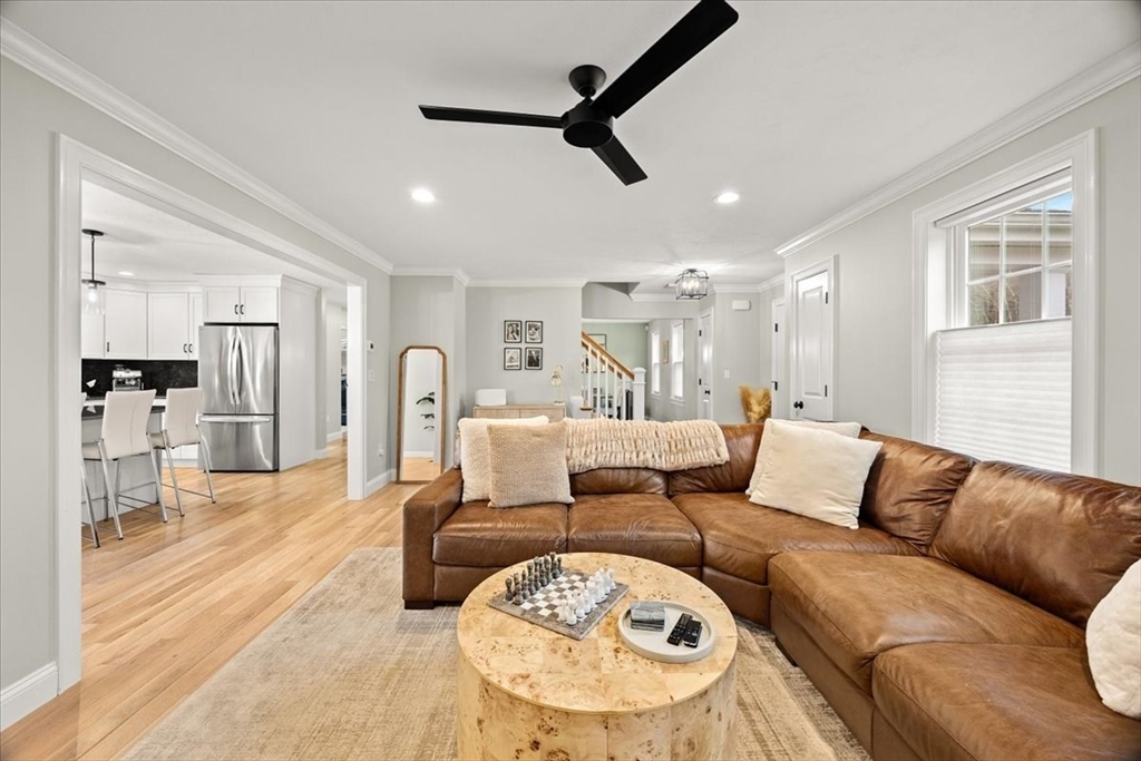 70 Sandy Hill Road Raynham, MA 02767 - Photo 8 of 42 a living room with furniture and a wooden floor