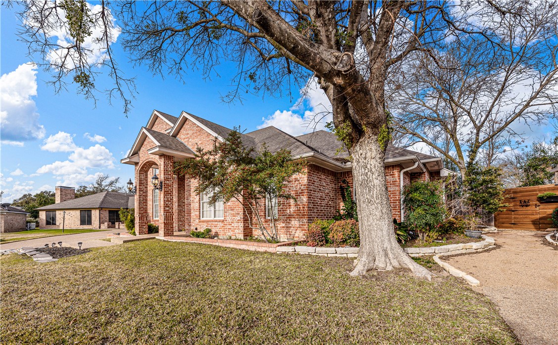3313 Fox Hollow Circle Waco, TX 76708 - Photo 11 of 88 a front view of a house with a yard covered with snow