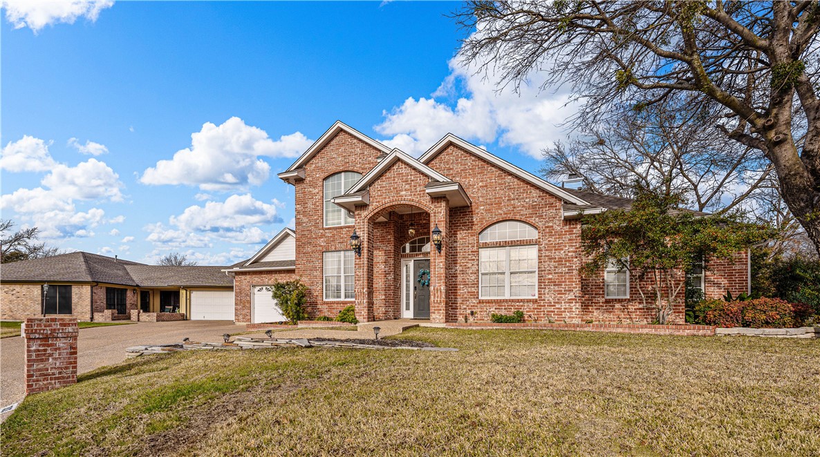 3313 Fox Hollow Circle Waco, TX 76708 - Photo 12 of 88 a front view of a house with garden