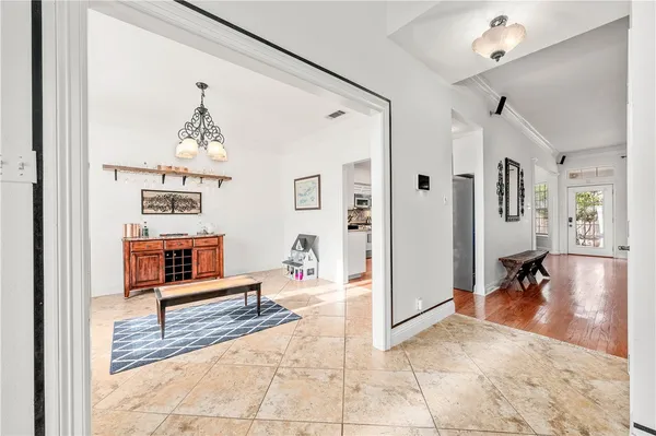 a kitchen with stainless steel appliances granite countertop a sink a stove and cabinets