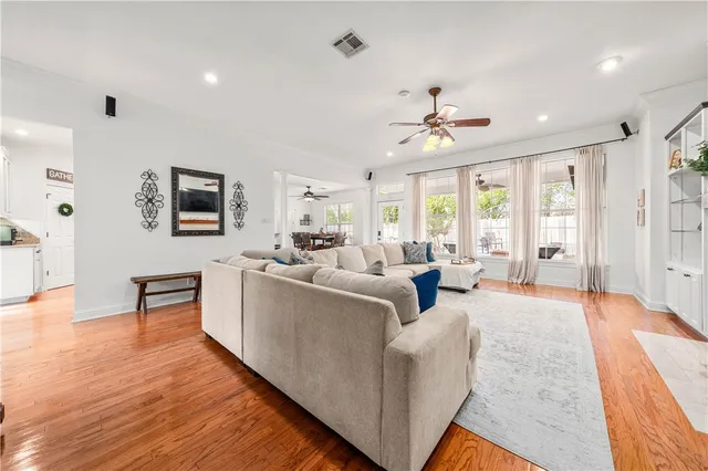 a view of a a dining room with furniture window and wooden floor