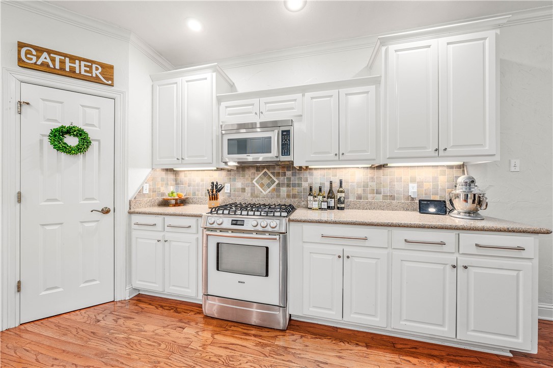 3313 Fox Hollow Circle Waco, TX 76708 - Photo 27 of 88 a kitchen with granite countertop a sink cabinets and stainless steel appliances