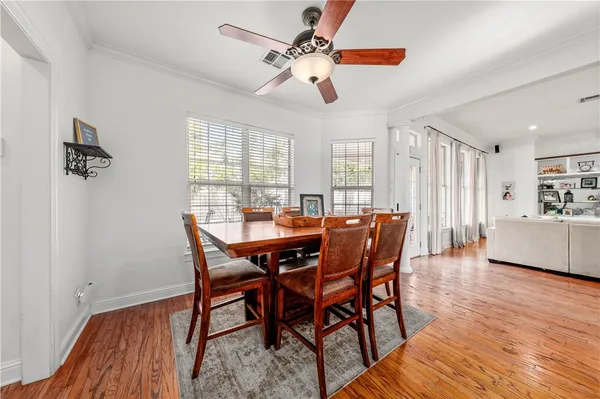 a view of room with window and ceiling fan