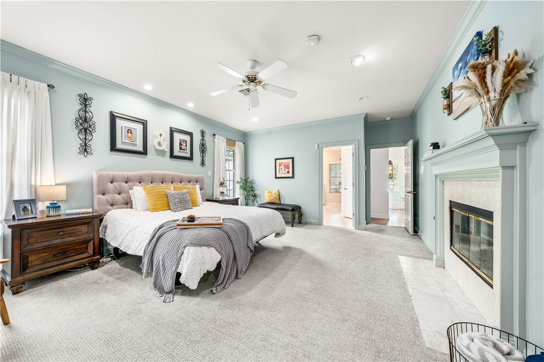 3313 Fox Hollow Circle Waco, TX 76708 - Photo 40 of 88 a spacious bedroom with a bed and a chandelier