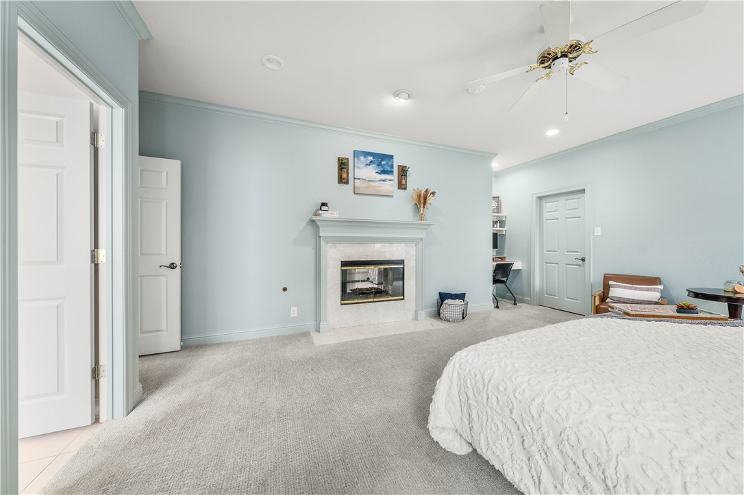 3313 Fox Hollow Circle Waco, TX 76708 - Photo 46 of 88 a spacious bedroom with a bed and a fireplace