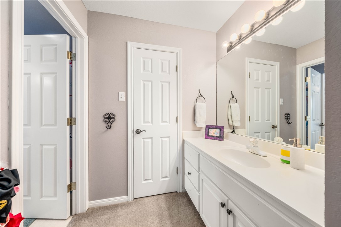 3313 Fox Hollow Circle Waco, TX 76708 - Photo 62 of 88 a bathroom with a double vanity sink mirror and