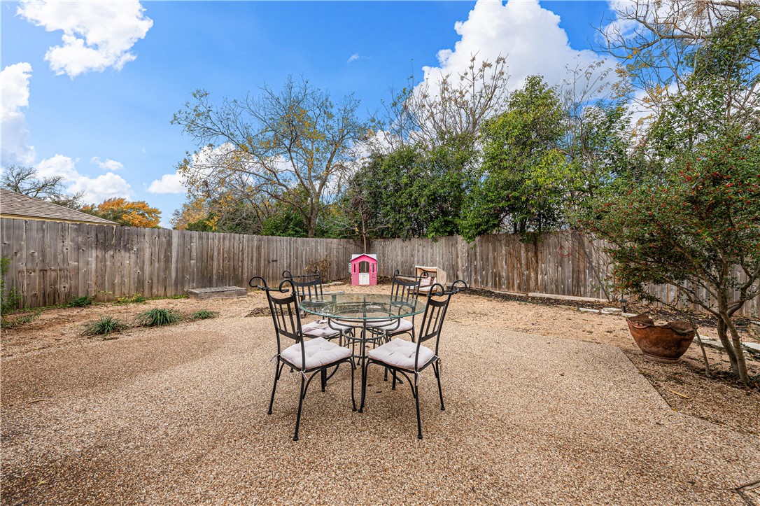 3313 Fox Hollow Circle Waco, TX 76708 - Photo 75 of 88 a backyard of a house with table and chairs