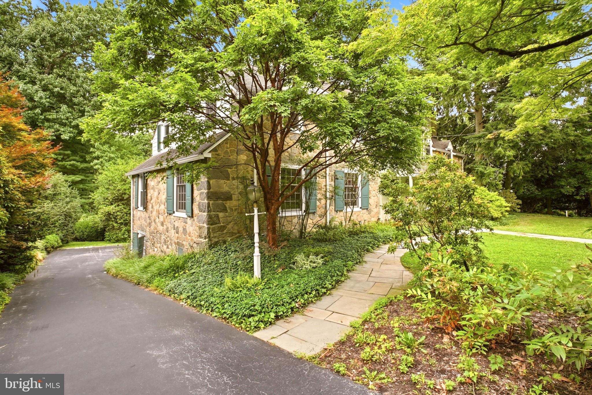 419 Riverview Road Swarthmore, PA 19081 - Photo 57 of 70 a front view of a house with garden