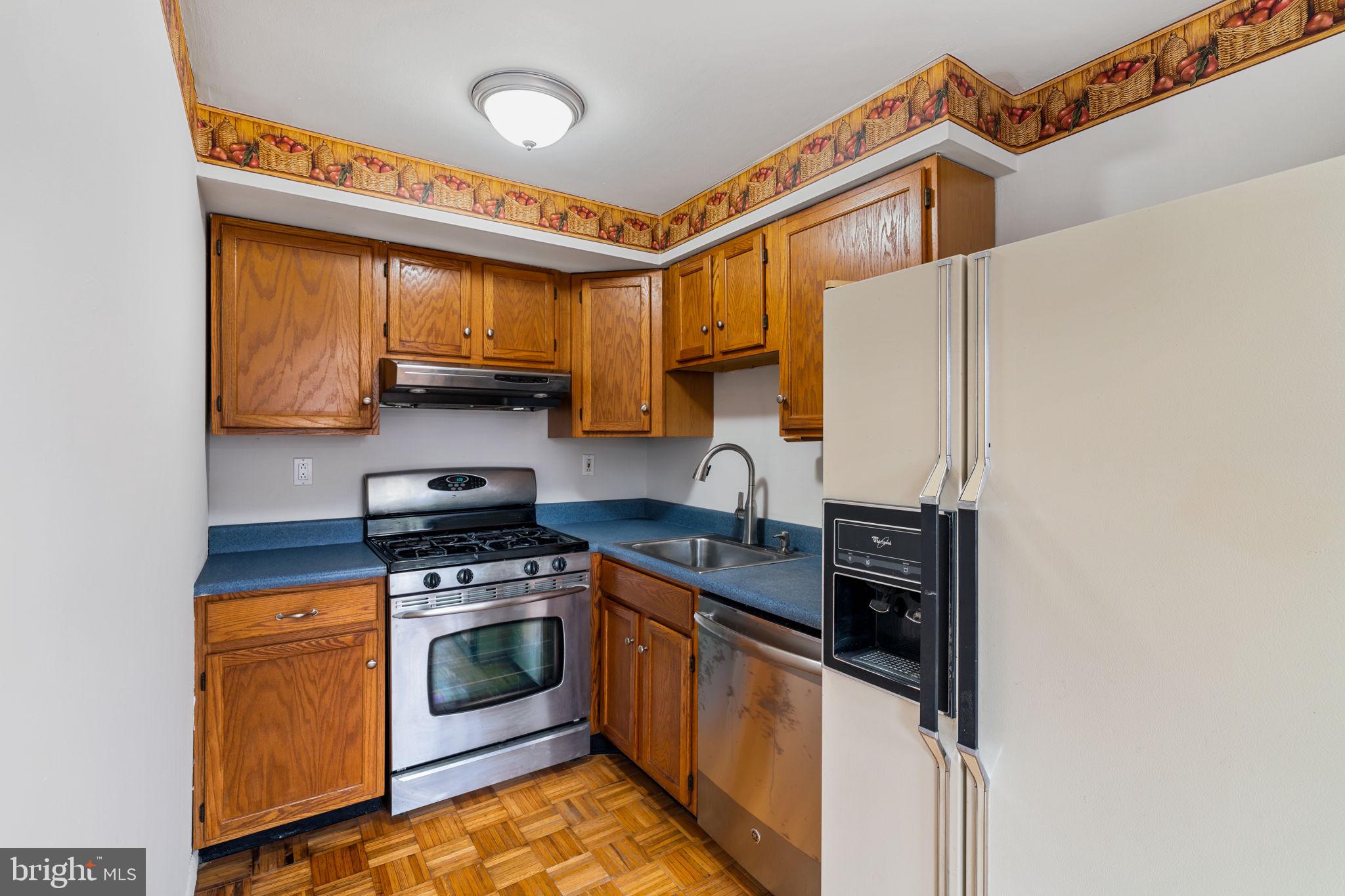 859 Andover Road Lansdale, PA 19446 - Photo 18 of 44 a kitchen with stainless steel appliances a stove a sink and a refrigerator