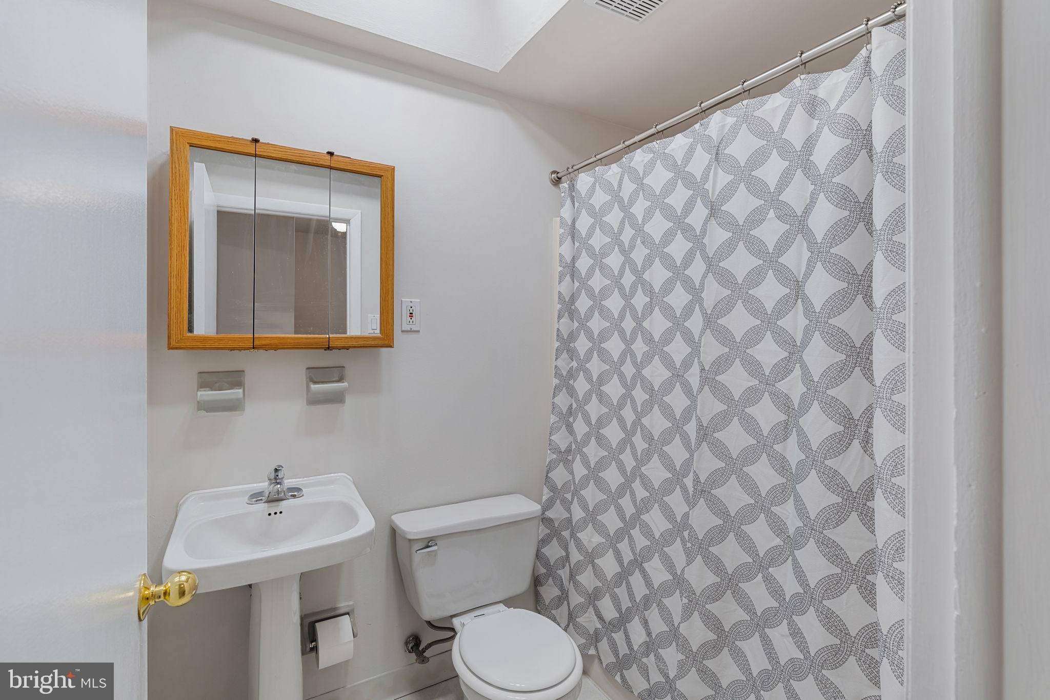 859 Andover Road Lansdale, PA 19446 - Photo 22 of 44 a bathroom with a sink and mirror with toilet