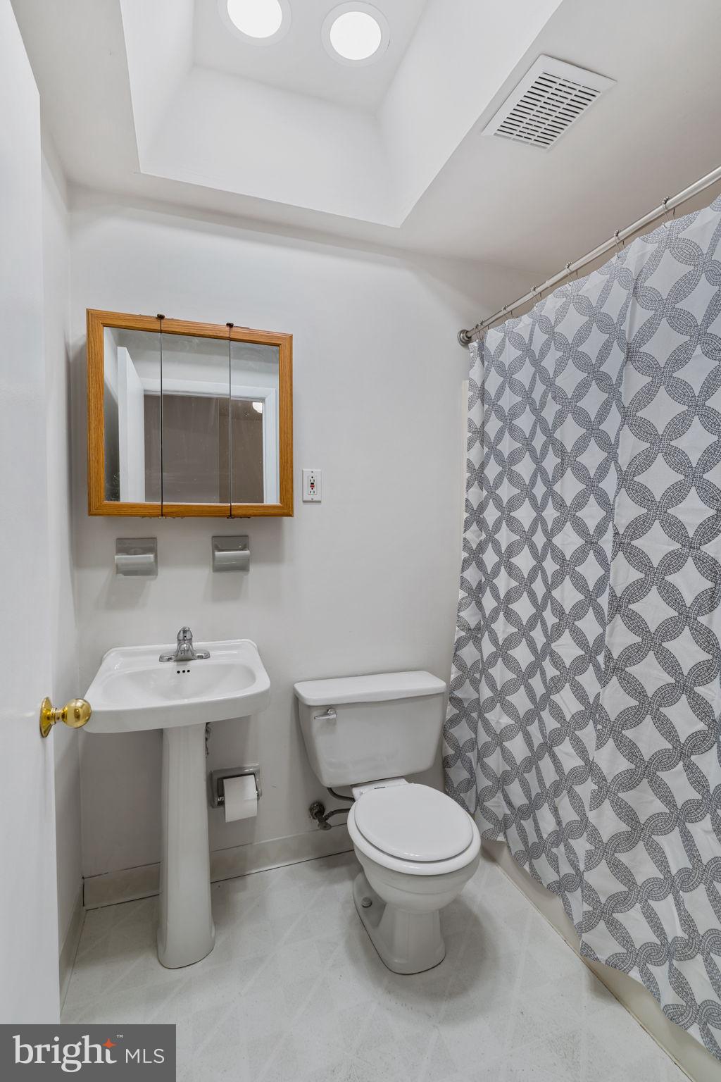 859 Andover Road Lansdale, PA 19446 - Photo 23 of 44 a bathroom with a toilet sink and mirror