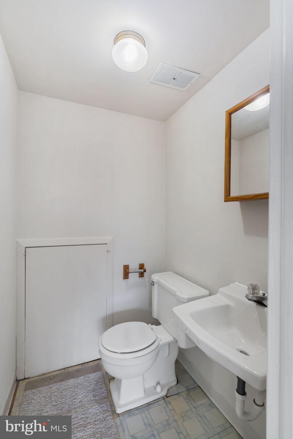 859 Andover Road Lansdale, PA 19446 - Photo 35 of 44 a white toilet sitting next to a bathroom sink