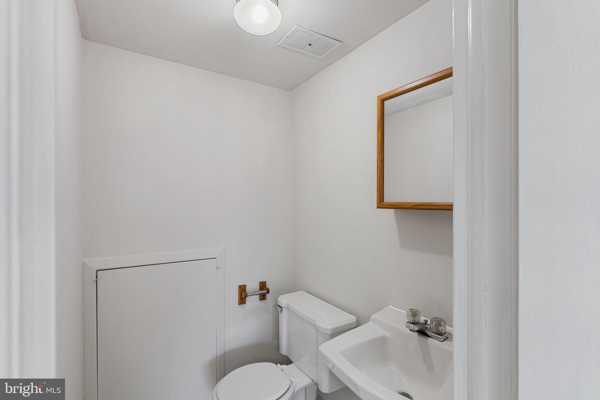 859 Andover Road Lansdale, PA 19446 - Photo 36 of 44 a bathroom with a sink mirror and toilet