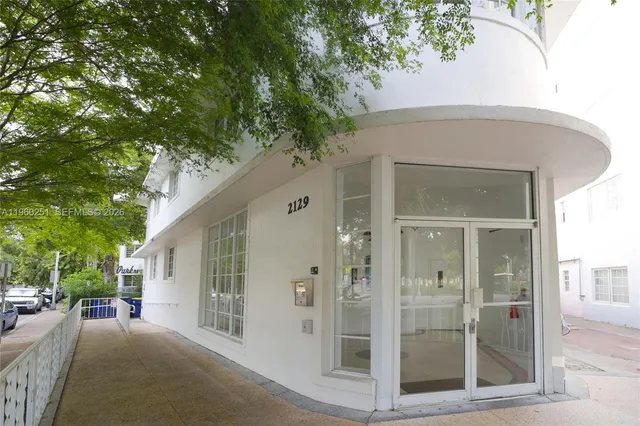 a view of a house with a tree